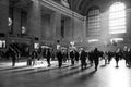 Rays of sunlight inside of Grand Central Station with people walking in the rush time